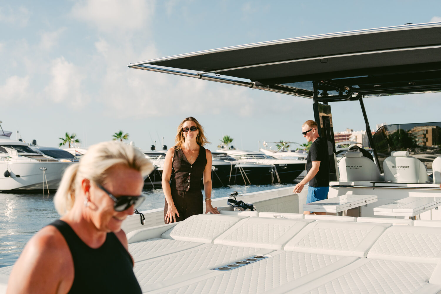Founders on a yacht deck at the marina