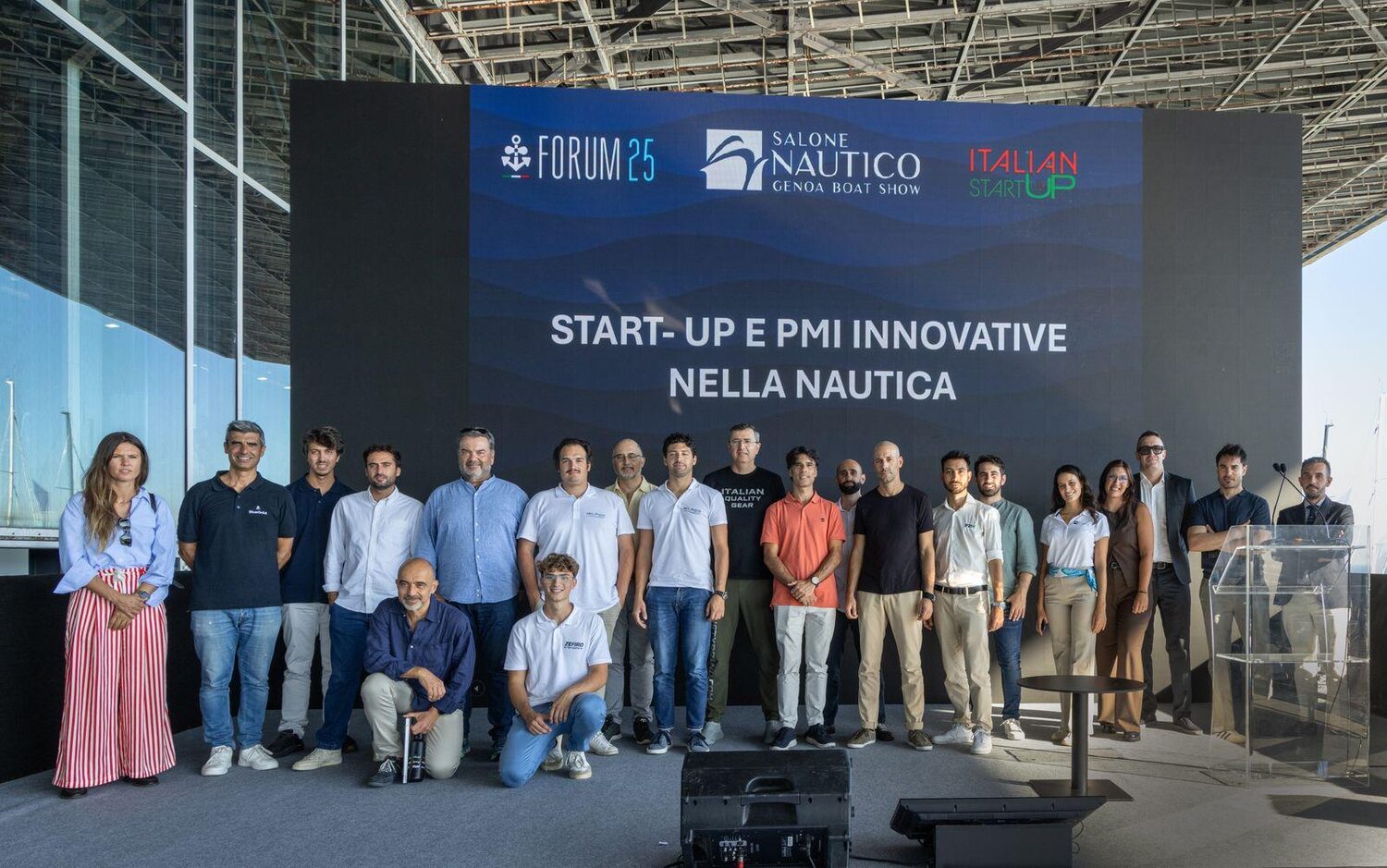 Startups pitching on stage at a boat show